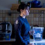 Police officer in the kitchen